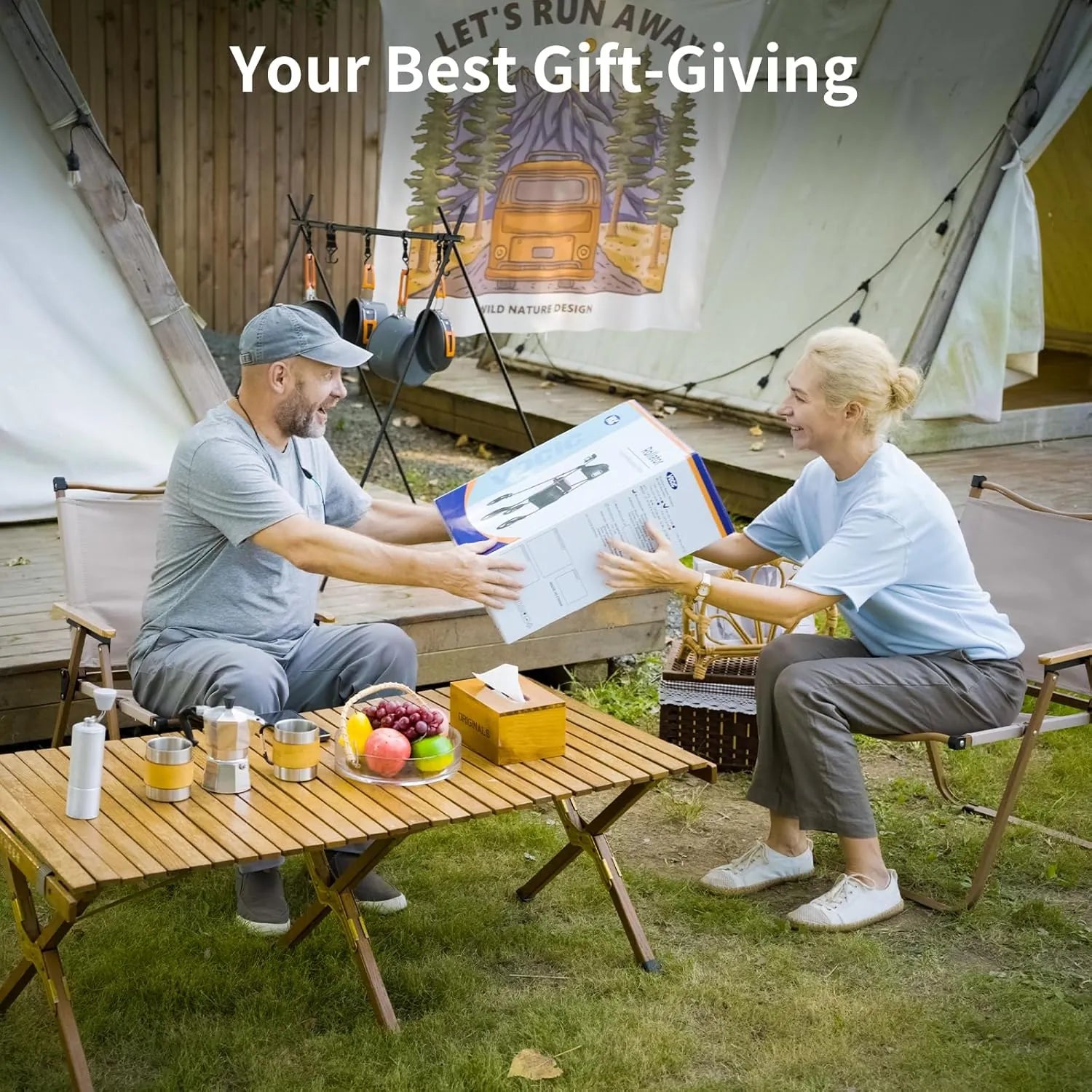 A Vocic Z21 rollator being given as a gift from an older woman to a similar aged man, set against a camping style backdrop.