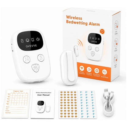 White wireless bedwetting alarm set with a main alarm unit, separate alarm piece, retail box, progress card, user manual, sticker sheet, and USB charging cable on a white background.