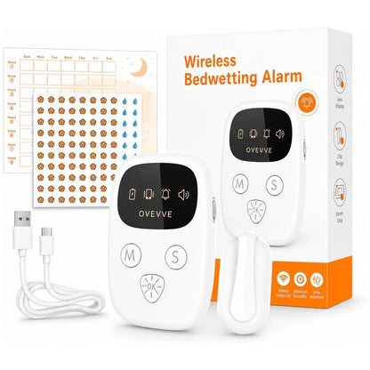 White wireless bedwetting alarm set with a small sensor clip, a larger alarm with a wrist strap, a USB charging cable, a printed instruction chart, and the retail box on a clean white background.