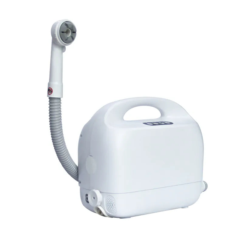 A portable white bedside shower machine with a flexible hose and a shower head, designed for in-bed patient cleaning.